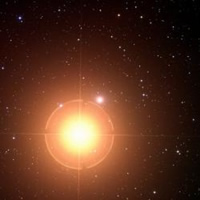 Snímek hvězdy Mirach a galaxie NGC 404, která se „krčí“ zhruba na jedné hodině přezářena světlem samotné hvězdy. Kredit ? NASA/JPL-Caltech/DSS